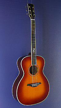You`s, sunburst finished Acoustic Guitar in OM shape with solid spruce top and mahogany on back and sides, with pickup